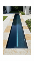Lap pool with linear water feature and stone coping